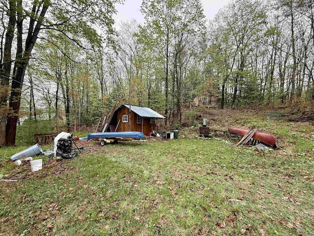23 Mason Hill Rd, Tamworth, NH 03886 - view of green lawn with a storage shed and an outdoor structure