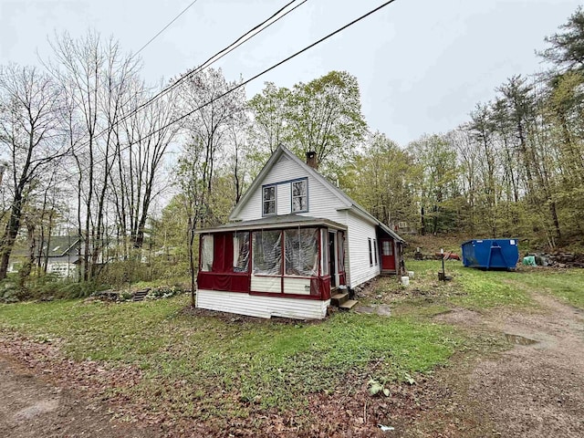 23 Mason Hill Rd, Tamworth, NH 03886 - rear view of house featuring a sunroom and a chimney