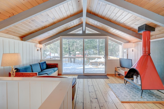 bedroom with wood ceiling, light wood-style floors, and access to exterior