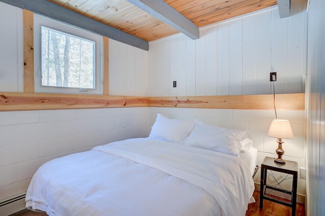 bedroom featuring wood ceiling, a baseboard heating unit, beam ceiling, and wood finished floors