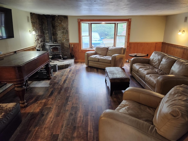 97 Ayers Rd, Canterbury, NH 03224 - living room with a wainscoted wall, wood walls, hardwood / wood-style flooring, and a wood stove