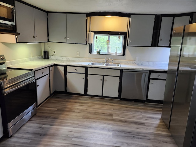 97 Ayers Rd, Canterbury, NH 03224 - kitchen featuring appliances with stainless steel finishes, a sink, and wood finished floors