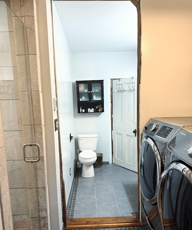 2678 Silver St, Hinesburg, VT 05461 - bathroom featuring independent washer and dryer, toilet, a stall shower, and tile patterned flooring