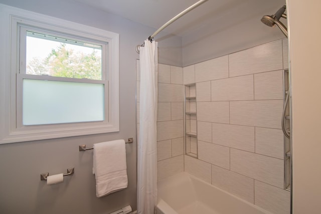 bathroom featuring shower / tub combo with curtain
