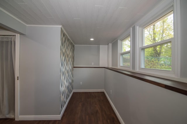 hall with wood finished floors, baseboards, recessed lighting, and crown molding