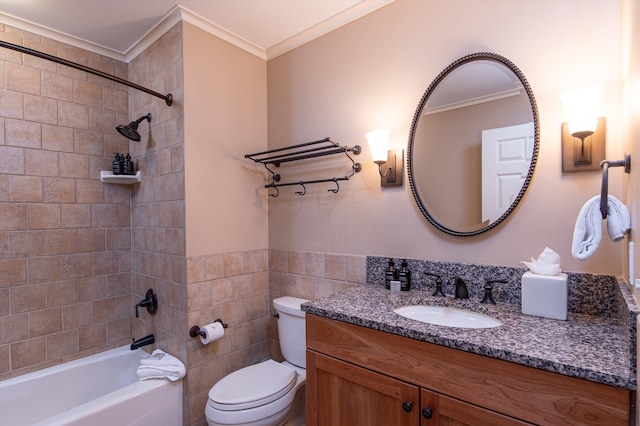full bathroom with ornamental molding, toilet, tile walls, vanity, and bathing tub / shower combination