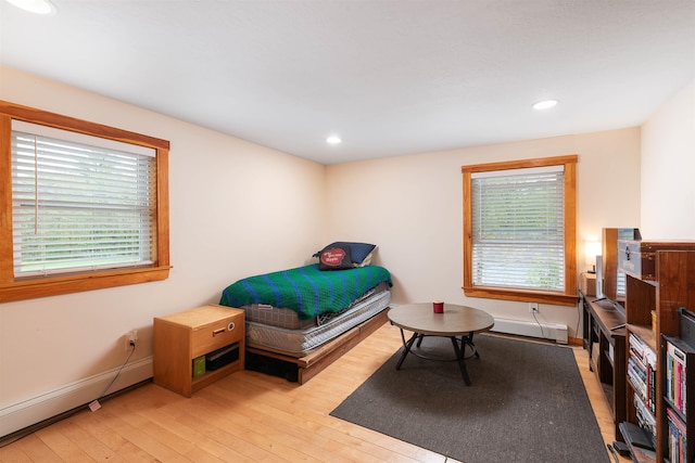 40 Butternut Ln, Conway, NH 03813 - bedroom with light wood-style flooring, a baseboard heating unit, recessed lighting, and baseboards
