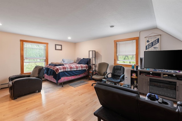 40 Butternut Ln, Conway, NH 03813 - bedroom with hardwood / wood-style flooring, multiple windows, lofted ceiling, recessed lighting, and a baseboard heating unit