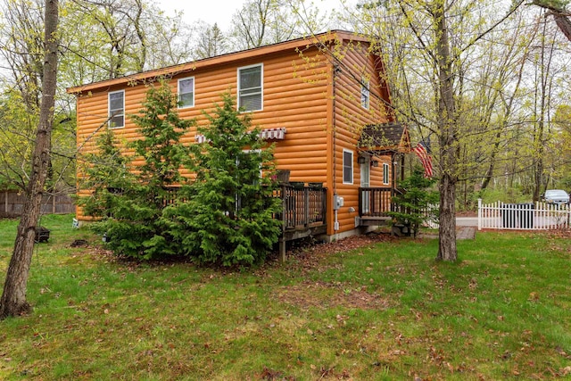 40 Butternut Ln, Conway, NH 03813 - view of home's exterior with a wooden deck and faux log siding