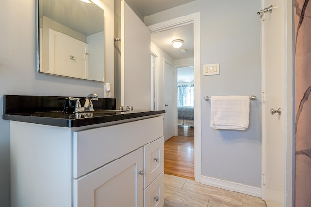 bathroom featuring vanity and baseboards