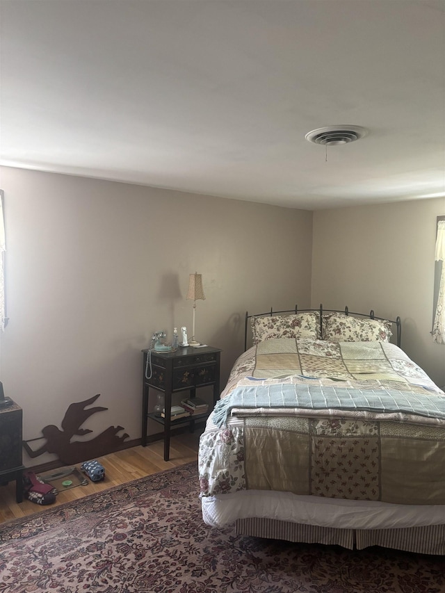 bedroom featuring wood finished floors