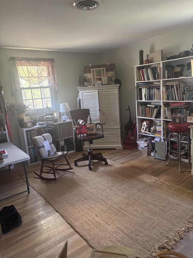 home office with wood finished floors