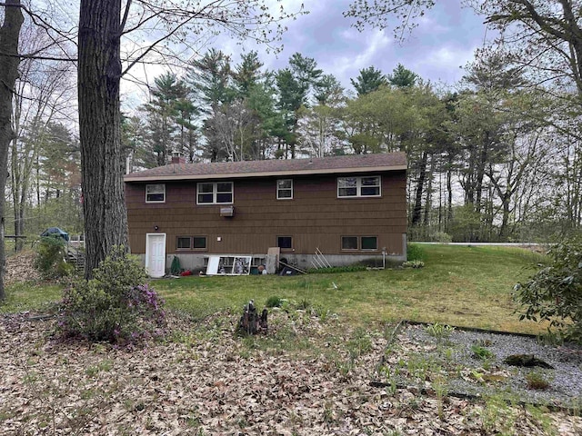 887 Harold Dow Hwy, Eliot, ME 03909 - back of house featuring a chimney and a yard