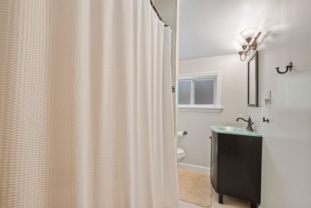 34 Bay Rd, Conway, NH 03818 - bathroom featuring toilet, vanity, and baseboards