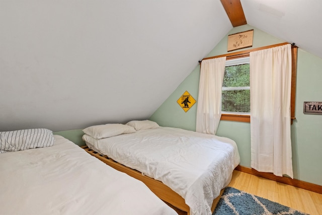 34 Bay Rd, Conway, NH 03818 - bedroom featuring wood finished floors, lofted ceiling, and baseboards