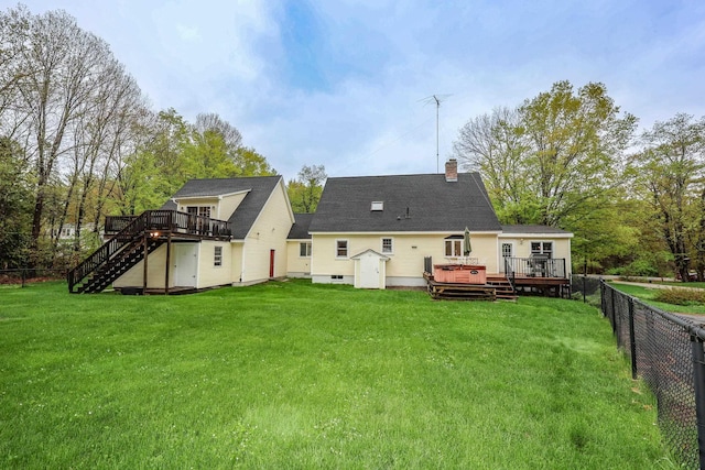 rear view of house with a wooden deck, stairs, a chimney, and crawl space