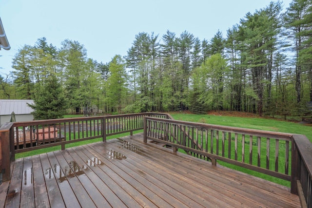wooden terrace with a lawn