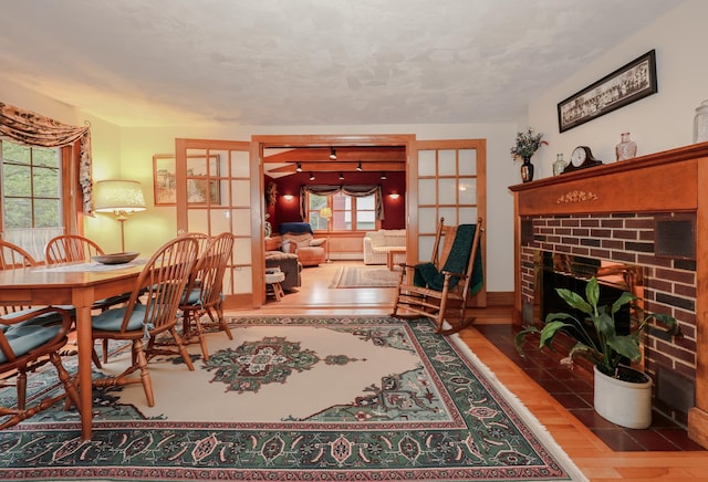 sitting room with wood finished floors and a fireplace