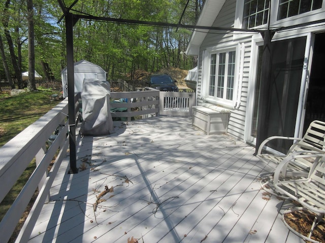 14 Morgan Rd, Hillsborough, NH 03244 - wooden terrace featuring a shed, an outdoor structure, and view of scattered trees