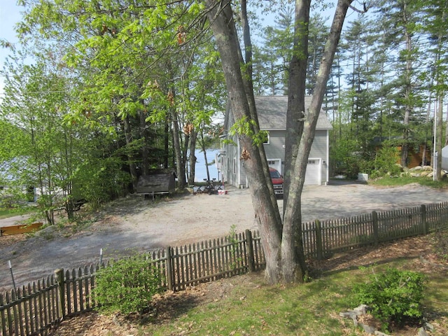14 Morgan Rd, Hillsborough, NH 03244 - fenced yard featuring a garage and driveway