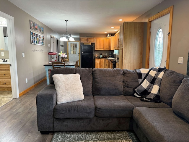 687 Chilafoux Hl, Irasburg, VT 05845 - living room with a chandelier, wood finished floors, baseboards, and recessed lighting