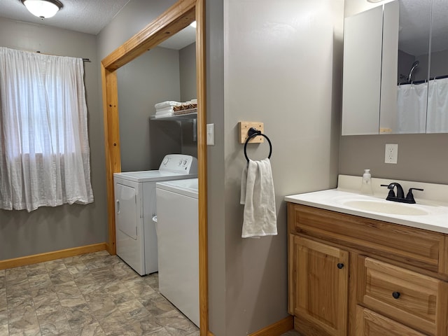 687 Chilafoux Hl, Irasburg, VT 05845 - bathroom with washing machine and clothes dryer, baseboards, and vanity