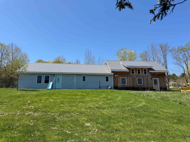 687 Chilafoux Hl, Irasburg, VT 05845 - view of front of home with metal roof, a front yard, and board and batten siding