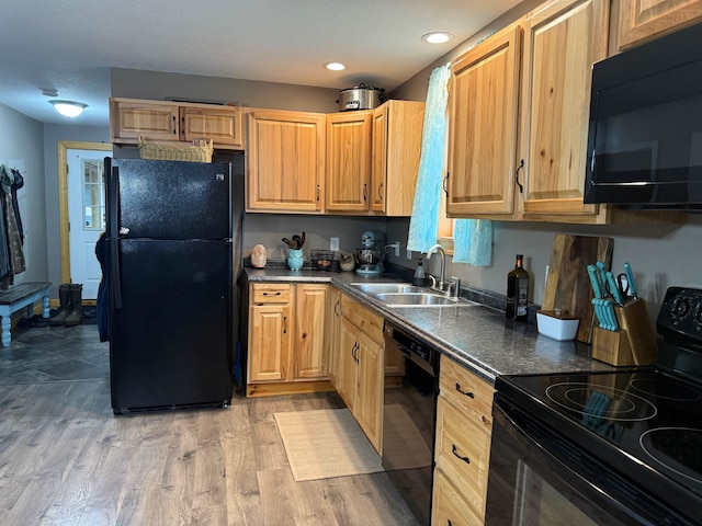 687 Chilafoux Hl, Irasburg, VT 05845 - kitchen featuring black appliances, a sink, dark countertops, recessed lighting, and light wood-style flooring