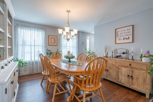 dining area featuring a chandelier and dark wood-style flooring