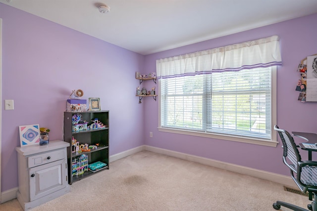 office with light carpet and baseboards