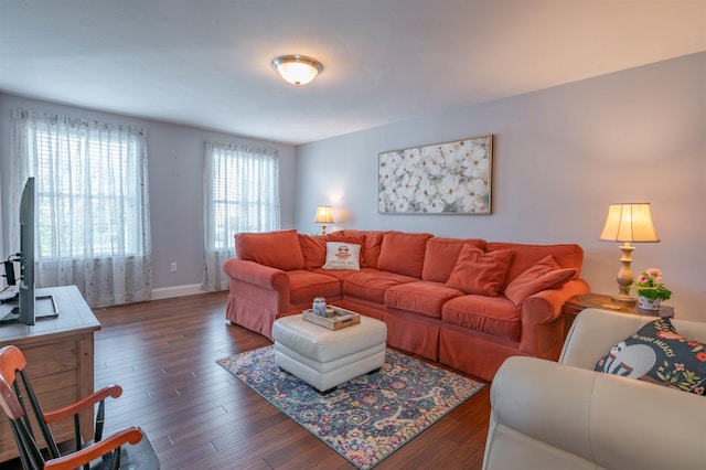 living area with wood finished floors and baseboards