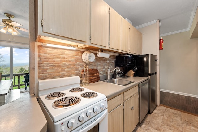 kitchen with stainless steel appliances, a ceiling fan, a sink, light countertops, and tasteful backsplash