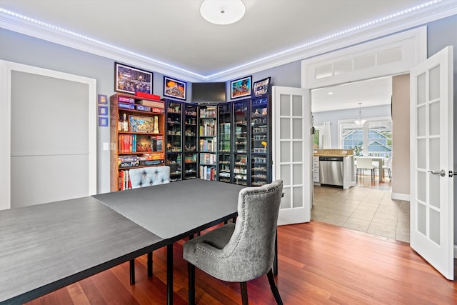 office featuring wood finished floors and crown molding