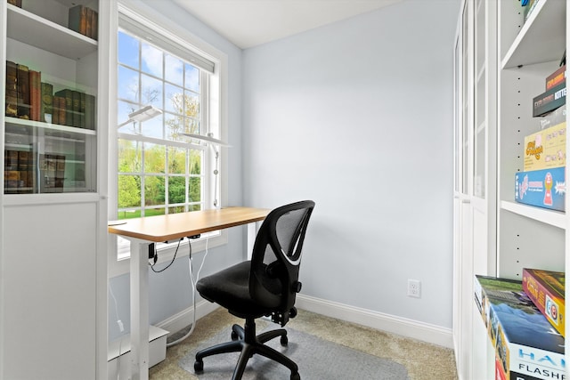 carpeted office featuring baseboards and healthy amount of natural light