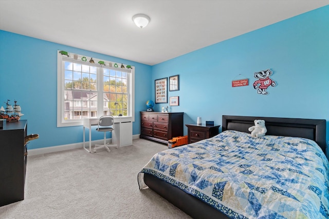 bedroom with baseboards and carpet flooring