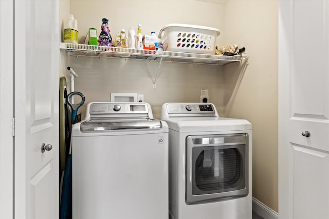 laundry room with separate washer and dryer