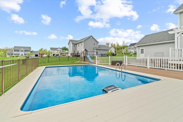 view of pool featuring a residential view and a wooden deck