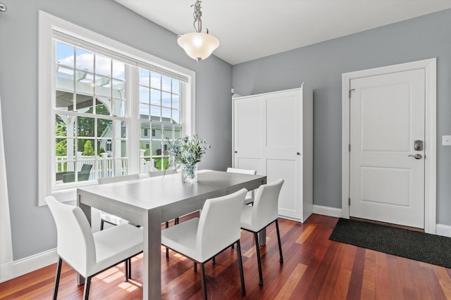 dining room with dark wood-style floors and baseboards