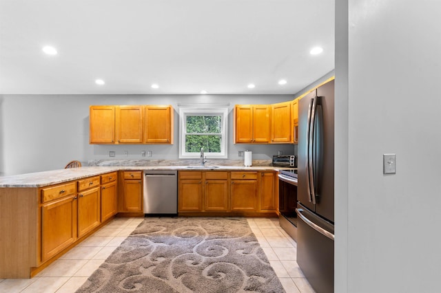108 Brenner Dr, Conway, NH 03818 - kitchen featuring appliances with stainless steel finishes, a sink, a peninsula, recessed lighting, and light tile patterned floors