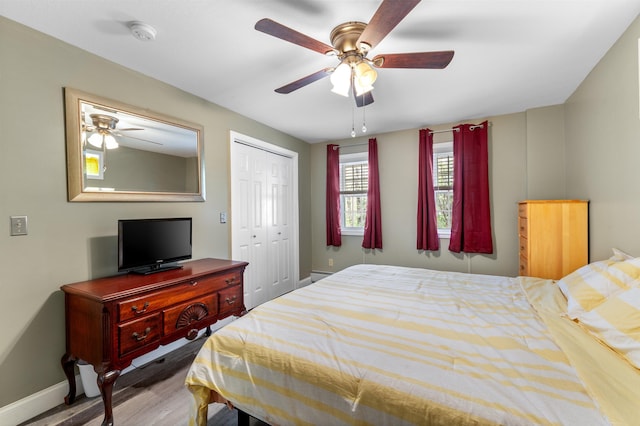 108 Brenner Dr, Conway, NH 03818 - bedroom with baseboards, wood finished floors, a closet, and a ceiling fan