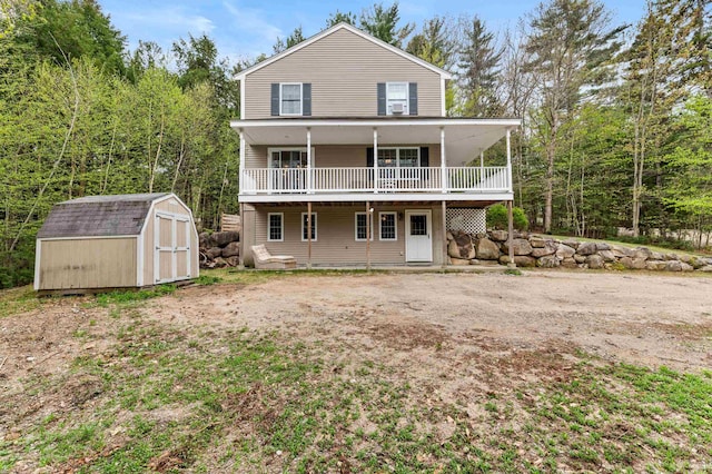 108 Brenner Dr, Conway, NH 03818 - rear view of house featuring a shed, an outdoor structure, and a deck
