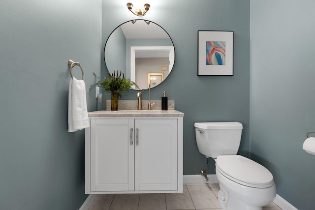 191 Barker St, North Andover, MA 01845 - half bathroom with baseboards, toilet, vanity, and tile patterned floors
