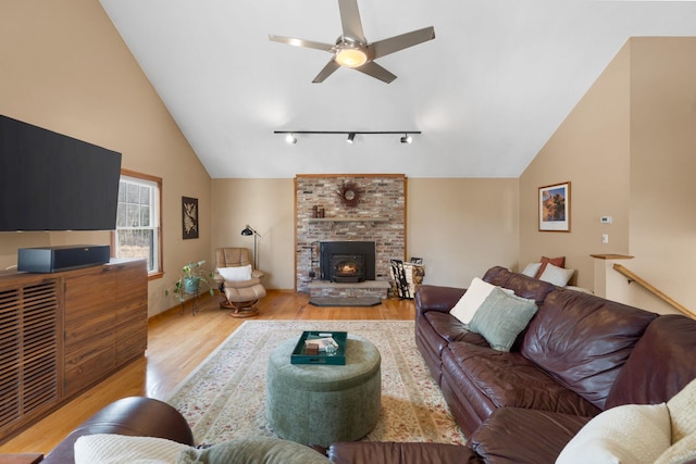 191 Barker St, North Andover, MA 01845 - living area with vaulted ceiling, wood finished floors, a ceiling fan, and rail lighting
