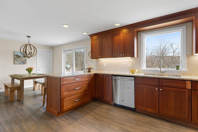 191 Barker St, North Andover, MA 01845 - kitchen featuring dishwasher, a sink, a peninsula, tasteful backsplash, and dark wood finished floors