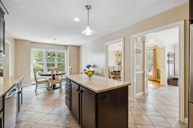 kitchen featuring dishwasher, arched walkways, plenty of natural light, dark brown cabinets, and recessed lighting