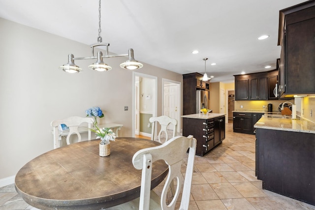 dining room with recessed lighting, baseboards, and light tile patterned floors