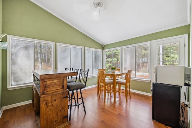 sunroom / solarium featuring lofted ceiling