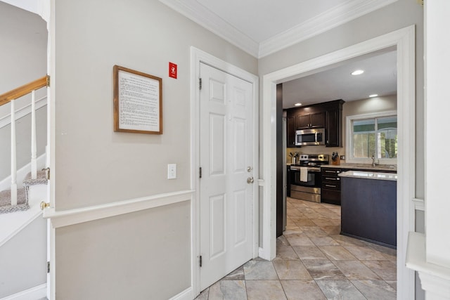 hallway featuring stairs, crown molding, baseboards, and recessed lighting