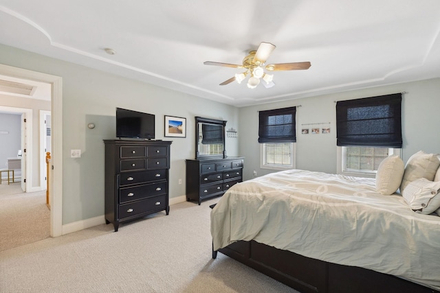 bedroom with carpet flooring, baseboards, and a ceiling fan