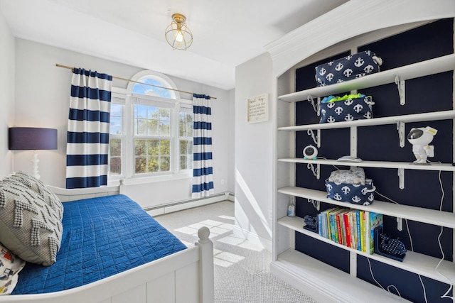 bedroom with baseboard heating, carpet flooring, and baseboards